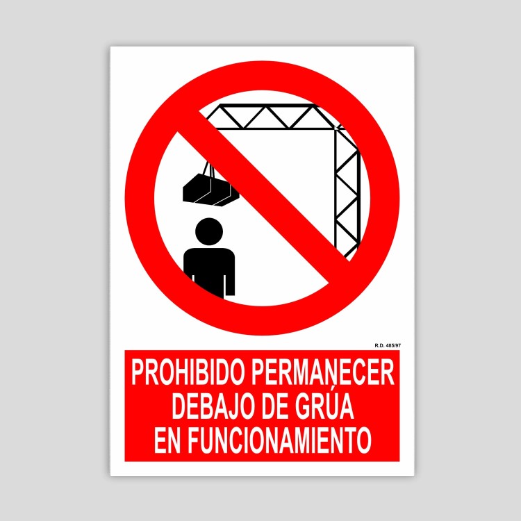 Cartel de prohibido permanecer debajo de grúa en funcionamiento